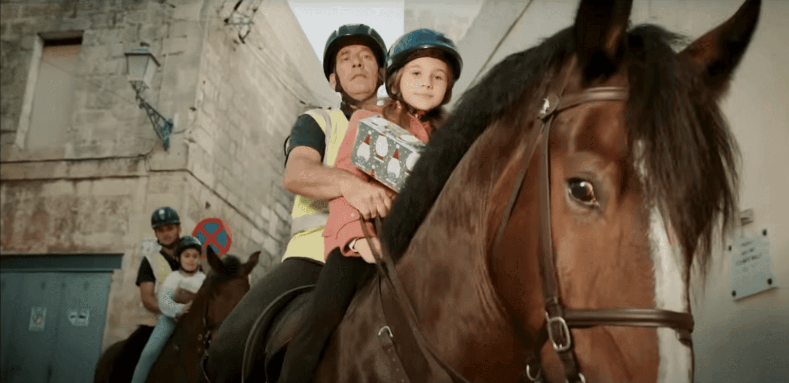 Two of the kids riding horses of the Police Cavalry