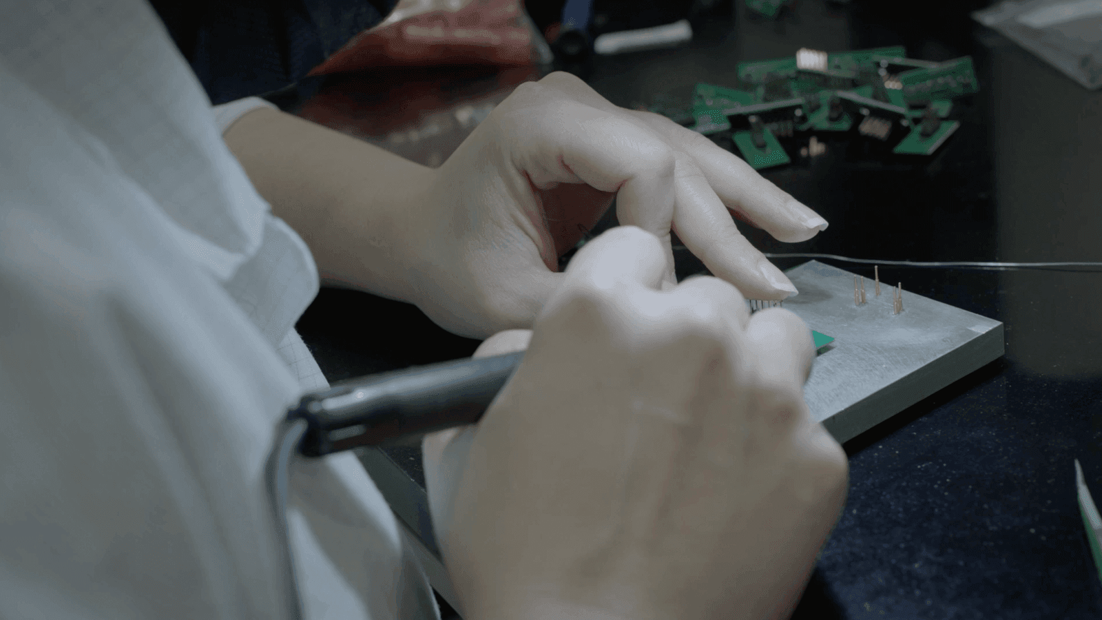 Fizoptika personnel working on a circuit board